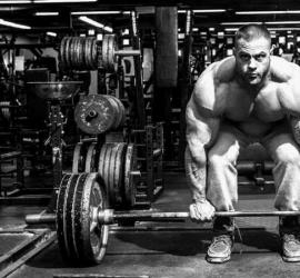 What is load progression in bodybuilding?